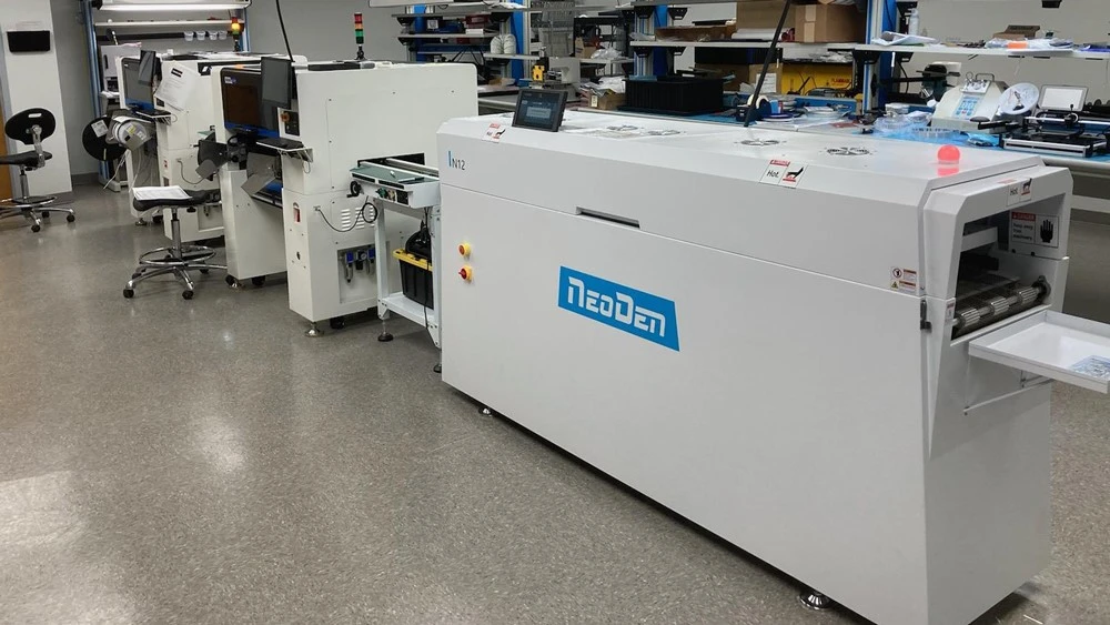 NeoDen IN12 12-Heating Zone Reflow Oven Operating in Electronics Factory NeoDen IN12 12-Heating Zone Reflow Oven Operating in Electronics Factory